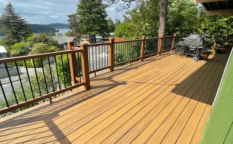Skilled technician performing Deck Repair on weathered outdoor wooden deck surface
