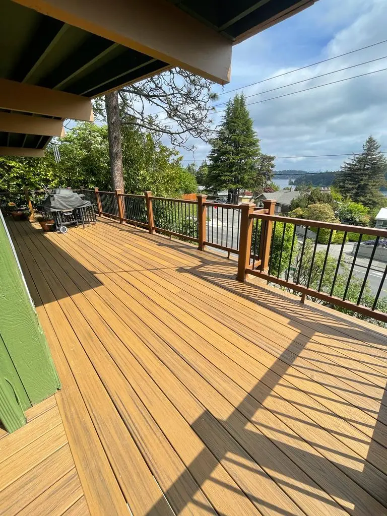 Custom Deck Builder creating modern backyard deck with seamless outdoor living space
