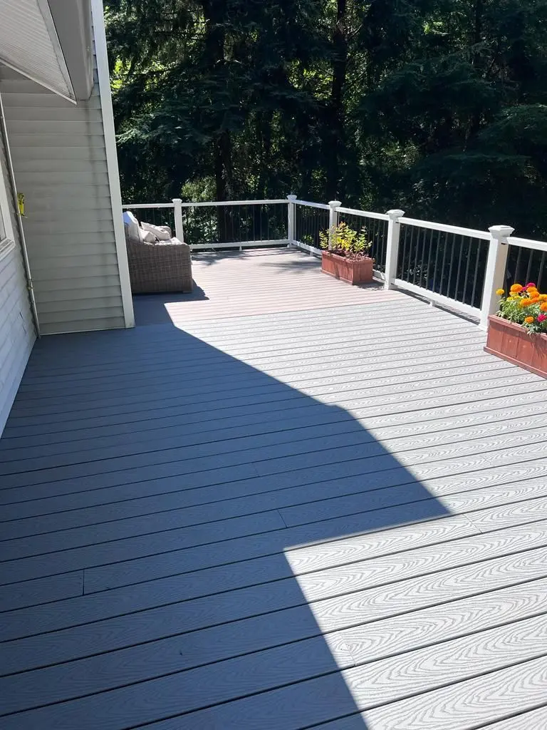 Multi-level outdoor deck crafted by Deck Builder for elevated home entertainment area