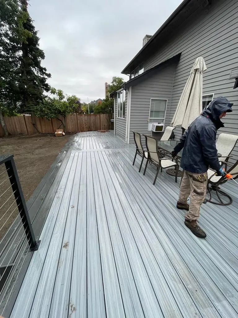 Skilled Deck Contractors installing a durable wood deck for homeowners